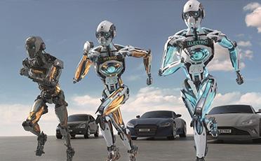 Három RobotQuartz robot fut el a háttérben álló autóktól